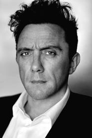 Peter Serafinowicz as Newsreader (voice) in The IT Crowd